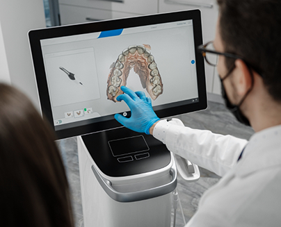 Showing patient image of teeth on monitor