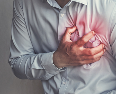 Close-up of person clutching their chest over their heart