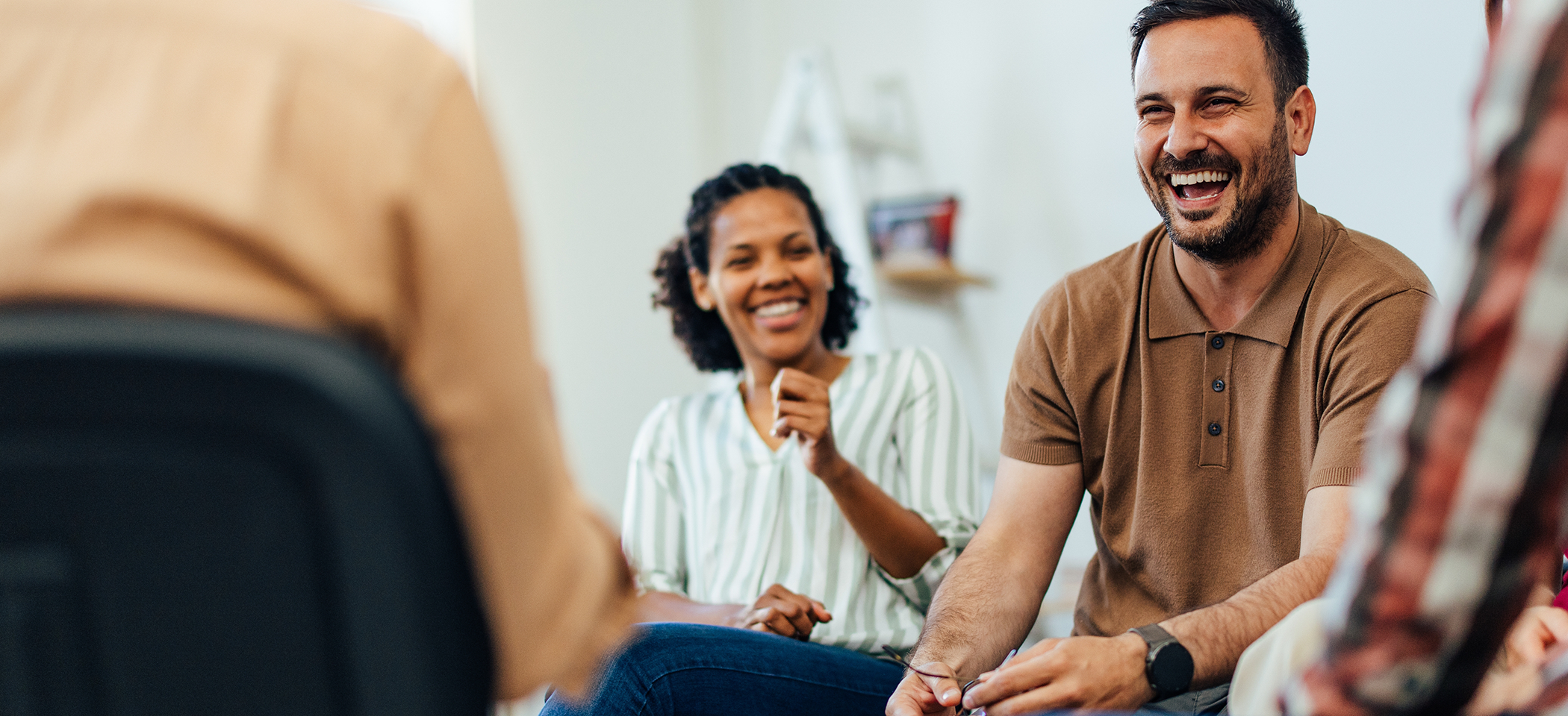 Male patient laughing in dental office