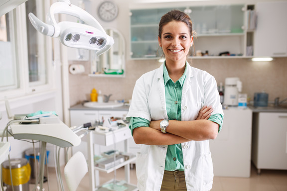 dentist smiling with arms crossed