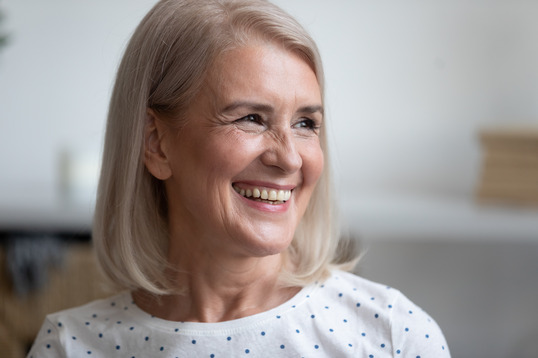 person smiling after getting dental implants 